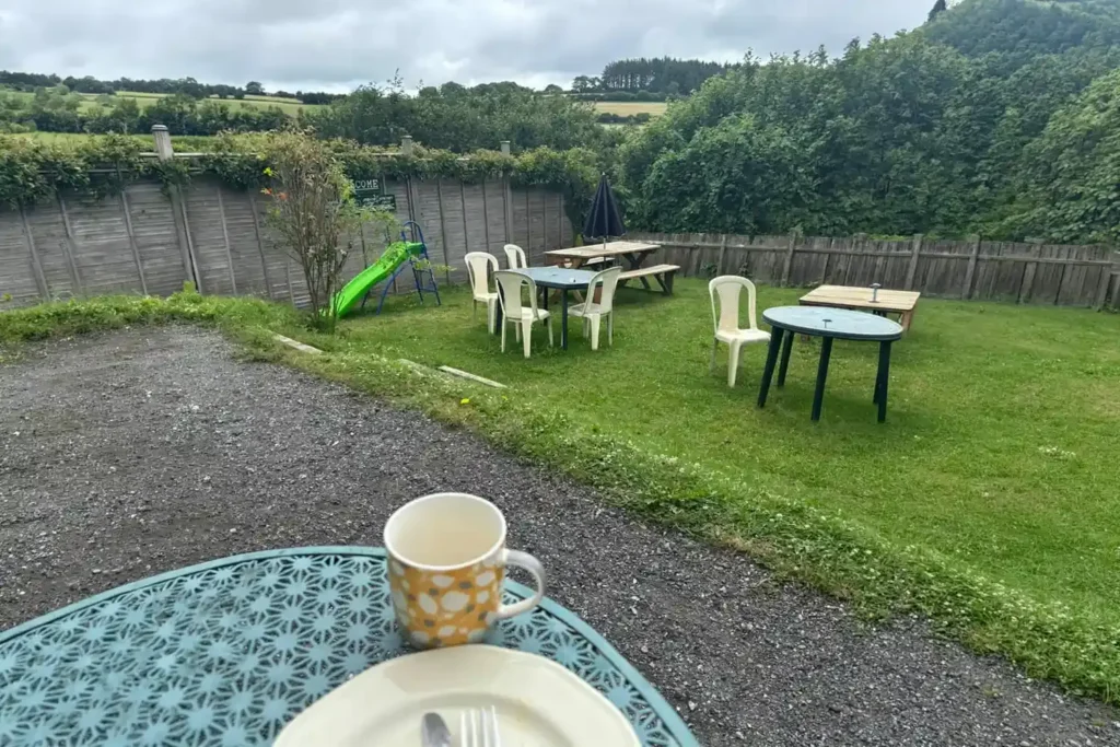 Visitors enjoying homemade breakfast and cream tea at Holne Tearoom, a café near Princetown in Dartmoor